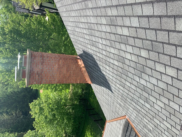 Custom Copper flashing installed on a homes brick chimney
