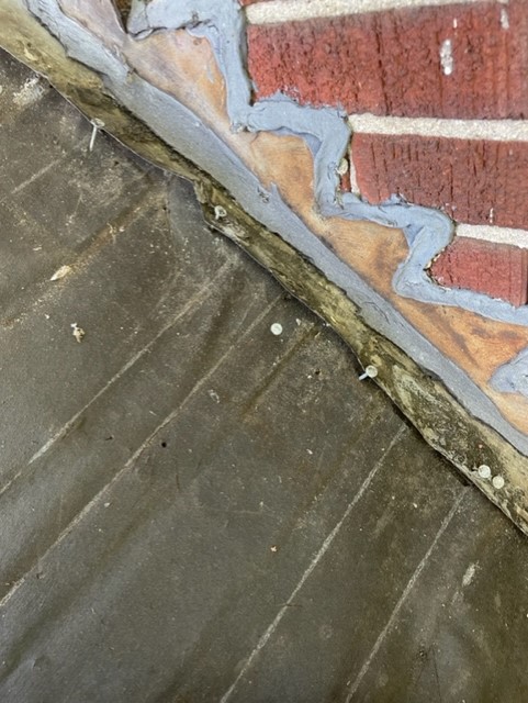Water Damage along brick and roof line